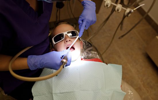 kids-at-the-dentist-getting-teeth-cleaned-BR23GTP